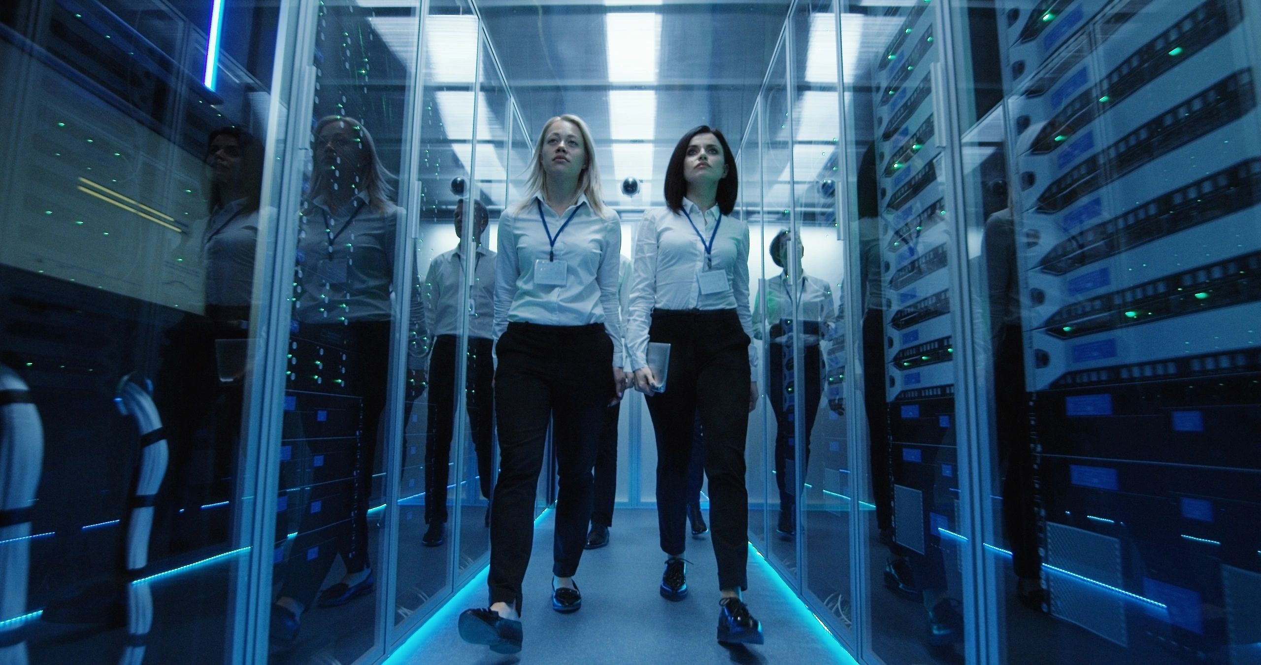 Professionals walking through a secure data center