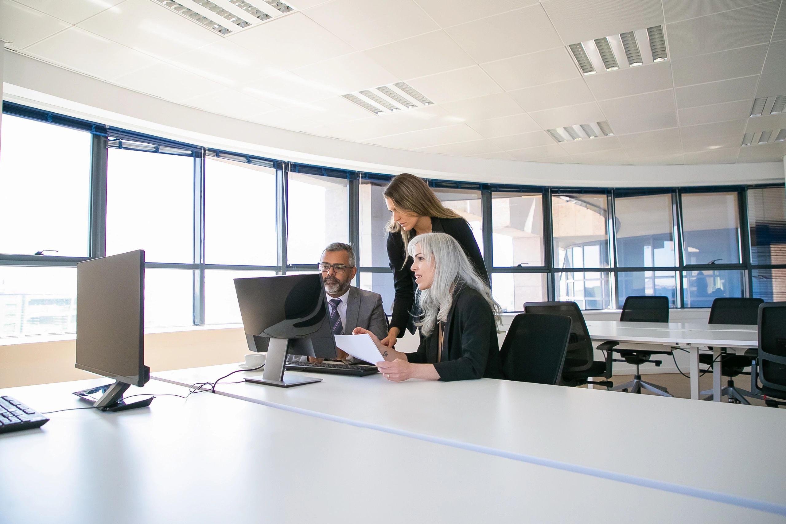 Technology consulting team meeting in a modern office