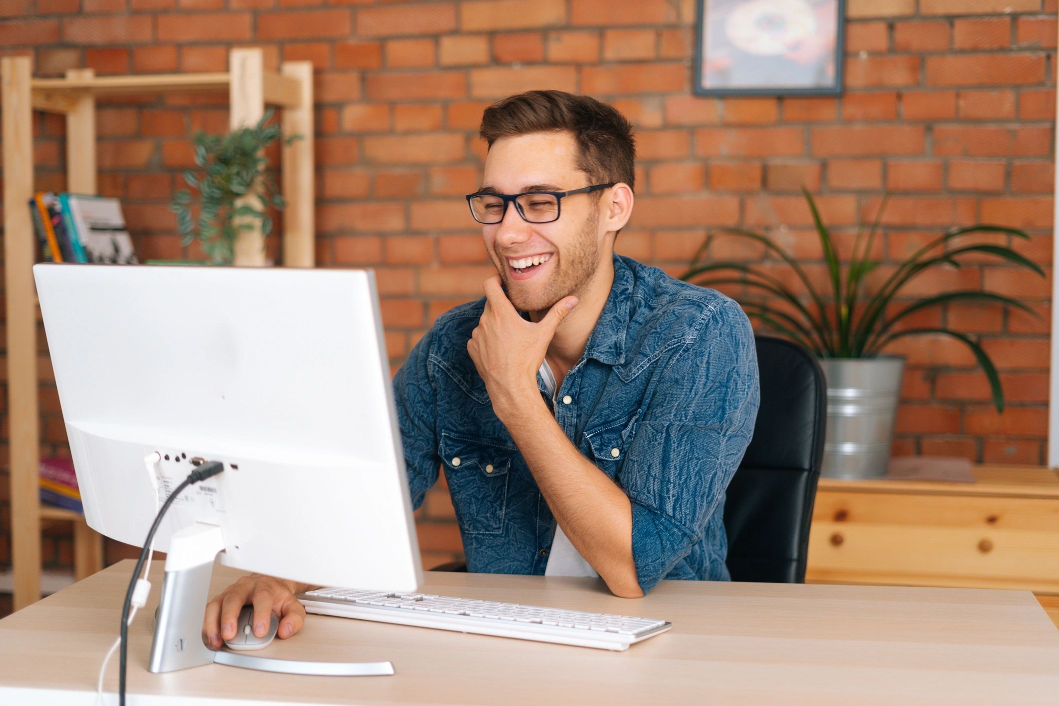 Home office computer user working at desktop setup