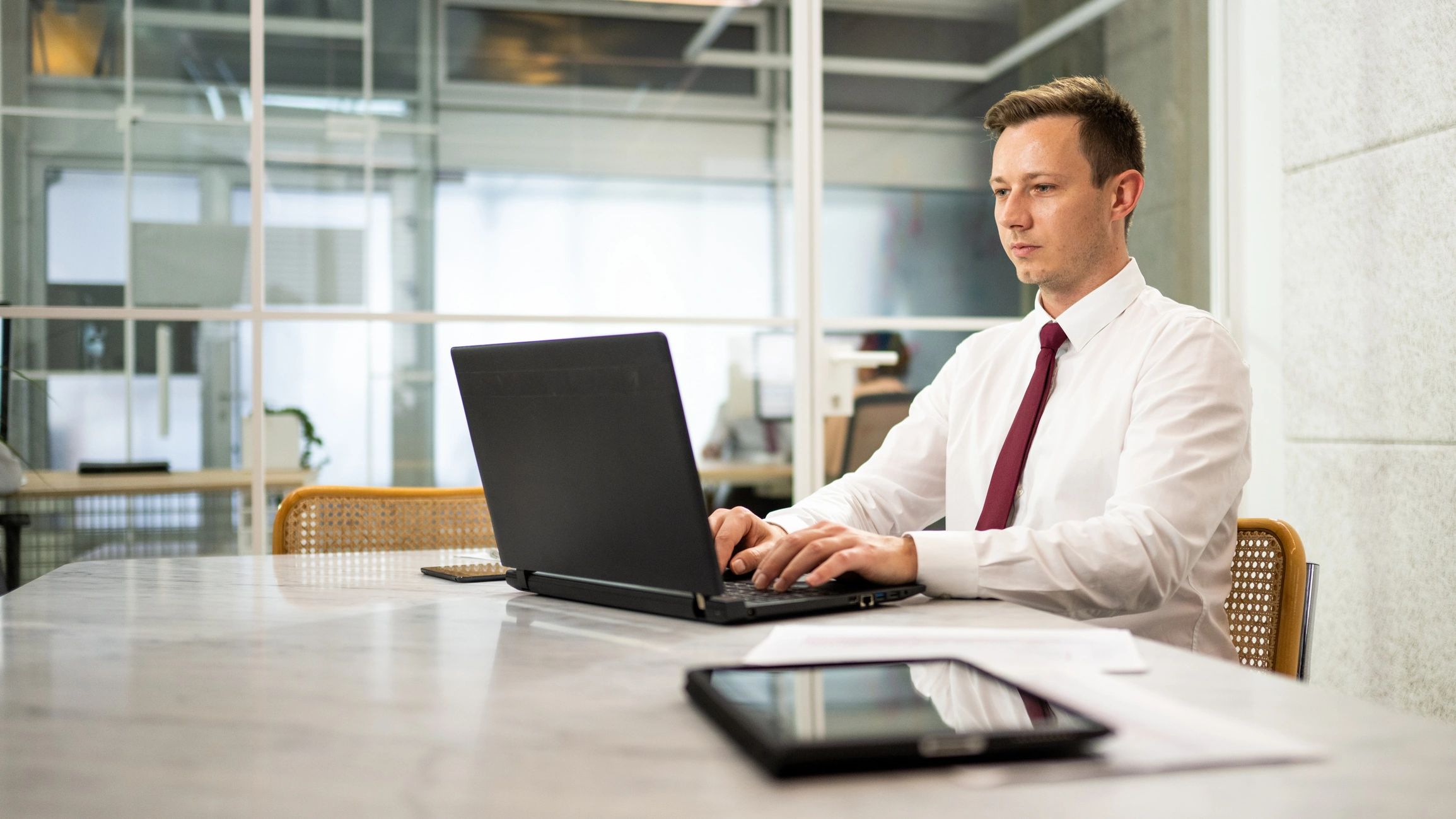 Business professional working on a laptop in an office