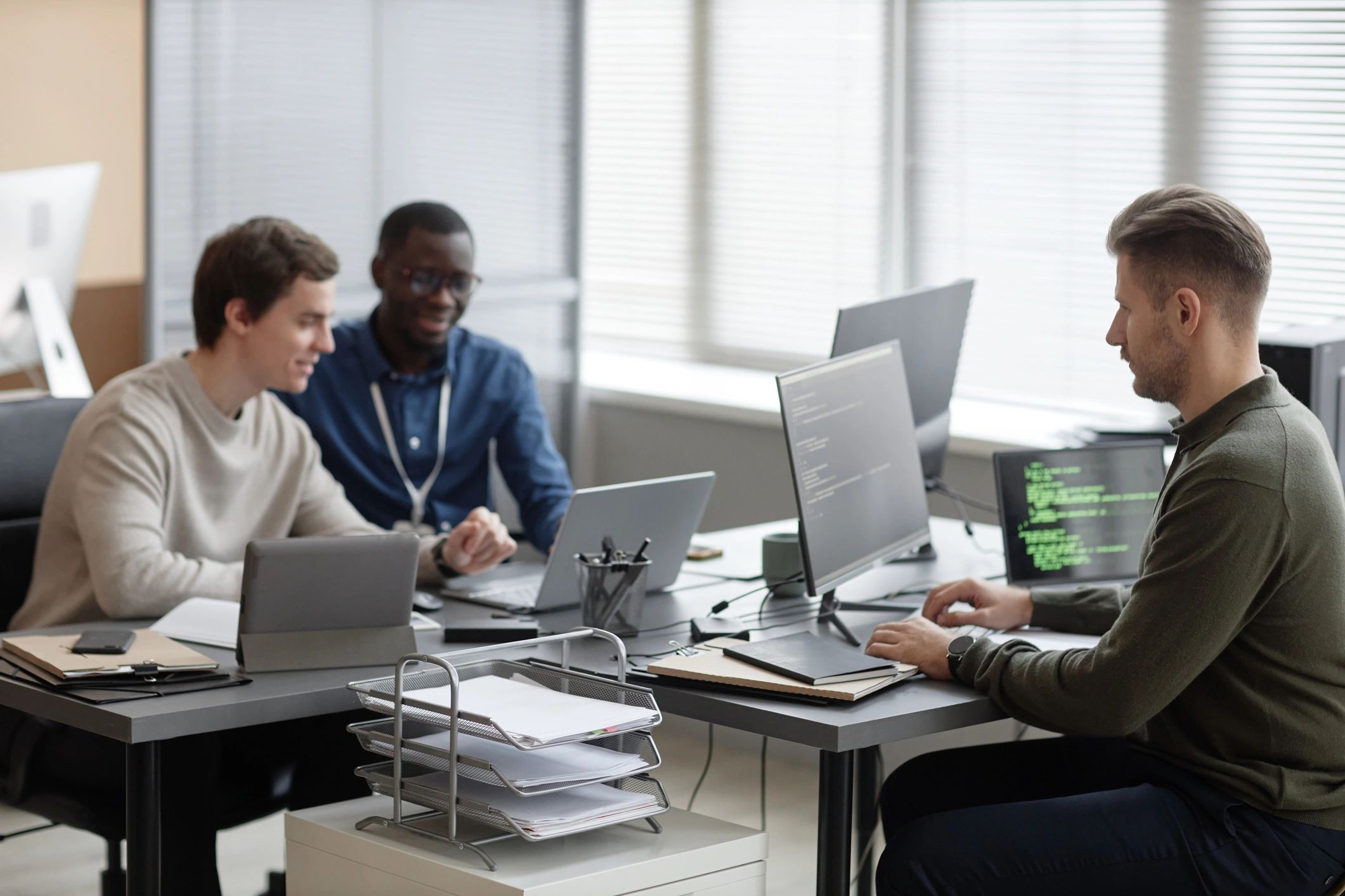 IT professionals collaborating in a modern technology office