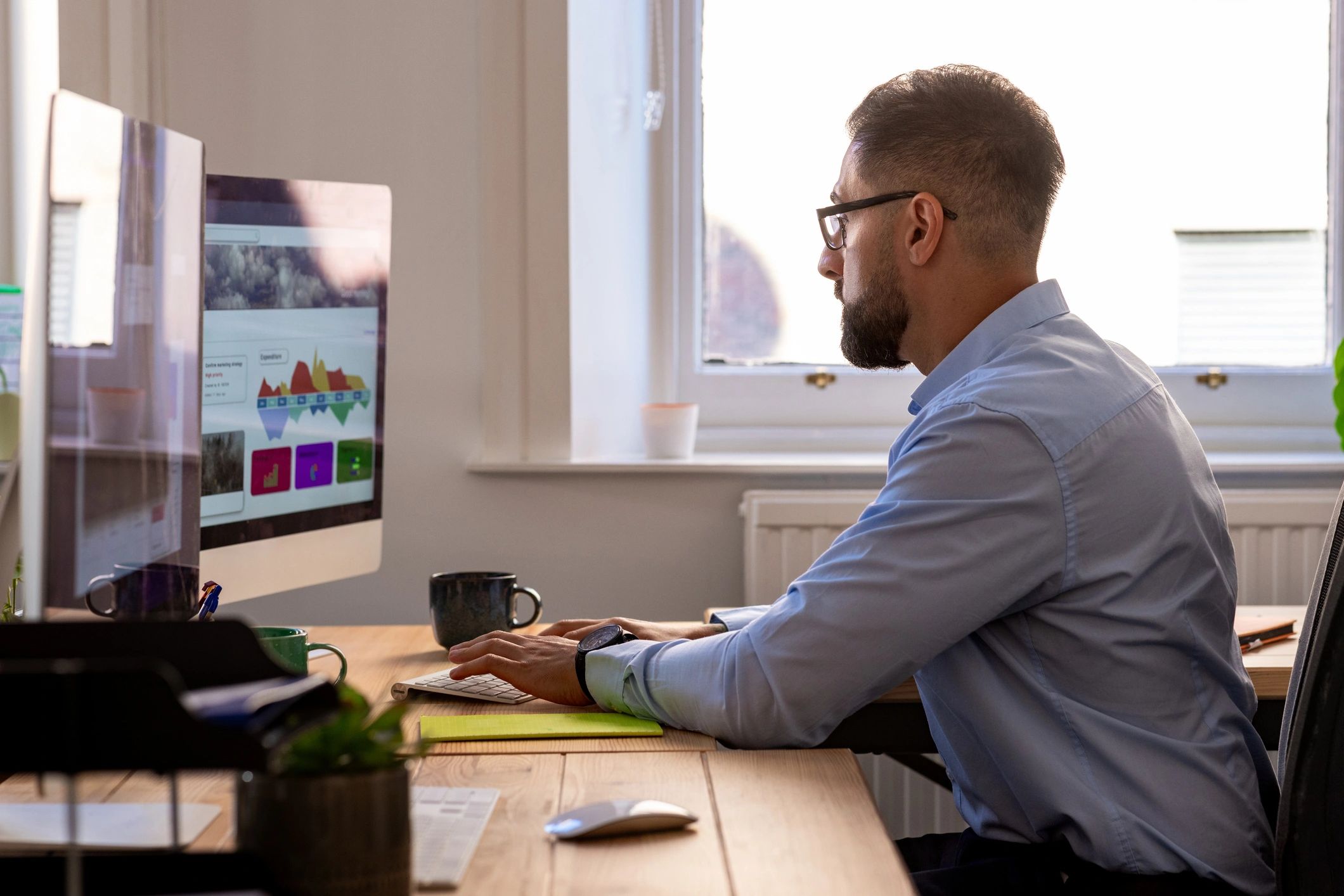 Professional working at a computer in a modern office